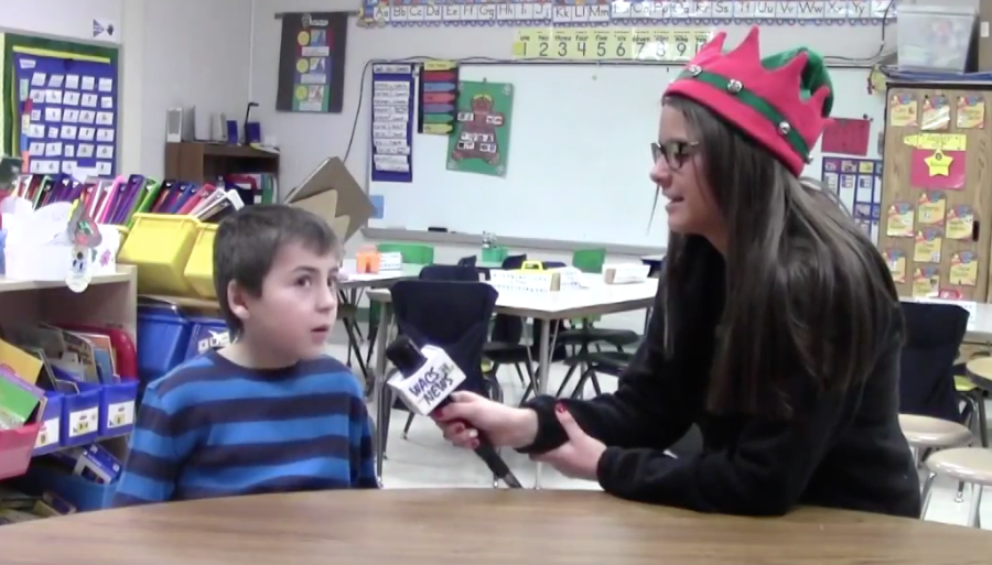 WACS+News+Reporter+Morgan+Rutan+interviews+a+student+about+their+gingerbread+house+project.