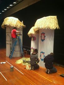 In 2012, Stage Crew puts the final touches on the Munchkin homes as part of the set for The Wizard of Oz